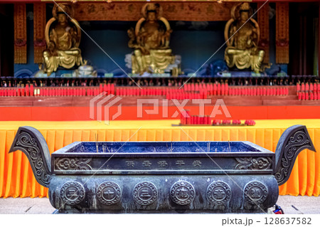 Hainan Island, Sanya: Nanshan Buddhist Center. View of the incense burner in front of the Temple 128637582