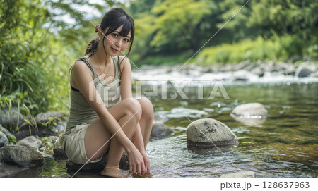 若い女性が川辺で涼む 128637963