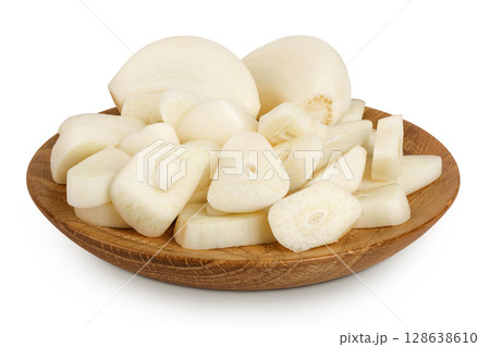 garlic cloves slices in wooden bowl isolated on white background close up 128638610