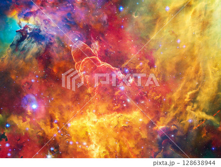 Multicolored structures of gas and dust swirl within a bright star-forming region of space, framed by glowing filaments and shadowed pockets. Multicolored structures of gas and dust swirl within a bright star-forming region of space, framed by glowing filaments and shadowed pockets. 128638944