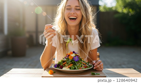 beautiful girl eating salad at cafe beautiful girl eating salad at cafe 128640942