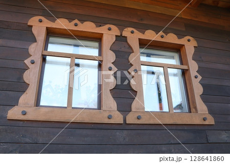 Traditional Wooden Windows Featuring Beautifully Decorative Frames that Enhance Aesthetic Appeal Traditional Wooden Windows Featuring Beautifully Decorative Frames that Enhance Aesthetic Appeal 128641860