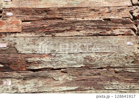 A beautifully textured and weathered wood surface that showcases natural aging and charm 128641917