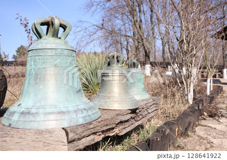 A beautiful Rustic Vintage Bell Collection displayed harmoniously in the embrace of Nature 128641922