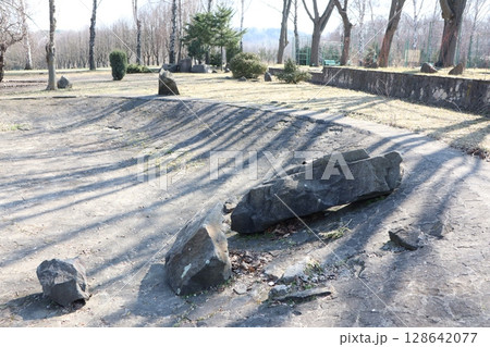 A Beautiful and Serene Landscape Featuring Large Rocks, Long Shadows, and Rich Natural Elements A Beautiful and Serene Landscape Featuring Large Rocks, Long Shadows, and Rich Natural Elements 128642077