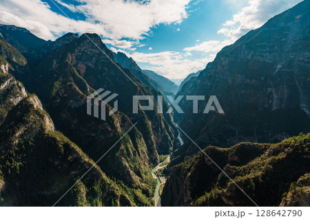 Misty Canyon View with Zip Line Station from Balagezong Scenic Area in Diqing, China Misty Canyon View with Zip Line Station from Balagezong Scenic Area in Diqing, China 128642790