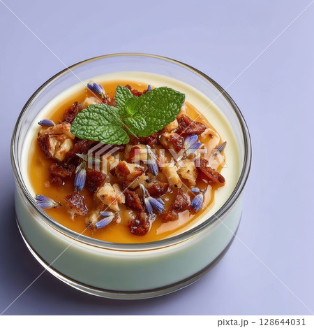 Lavender Panna Cotta Dessert with Blueberry Compote, Candied Lavender Buds, and Mint Leaf Garnish Lavender Panna Cotta Dessert with Blueberry Compote, Candied Lavender Buds, and Mint Leaf Garnish 128644031