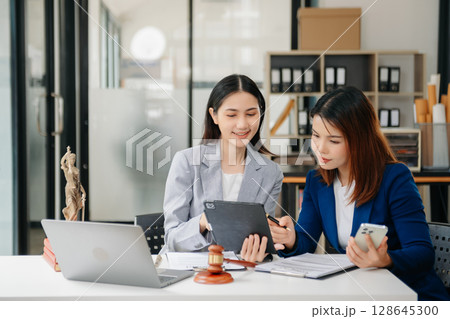 Asian Business law concept, Lawyer business lawyers are consulting lawyers for women entrepreneurs to file copyright lawsuit Asian Business law concept, Lawyer business lawyers are consulting lawyers for women entrepreneurs to file copyright lawsuit 128645300