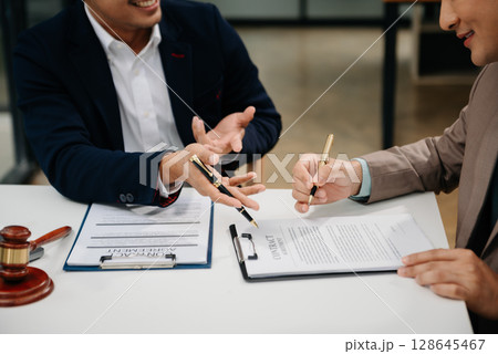 Business law concept, Lawyer business lawyers are consulting lawyers for women entrepreneurs to file copyright lawsuit with laptop and tablet at office 128645467