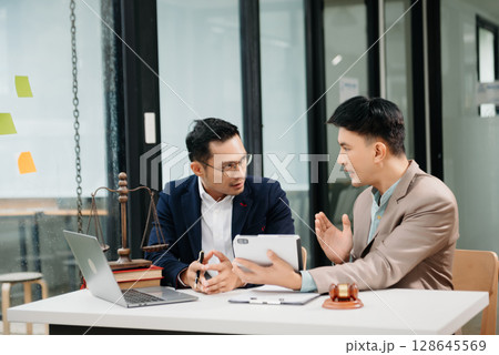 Business and Male lawyer or judge consult having team meeting with client, Law and Legal services concept.Customer service good cooperation in office Business and Male lawyer or judge consult having team meeting with client, Law and Legal services concept.Customer service good cooperation in office 128645569