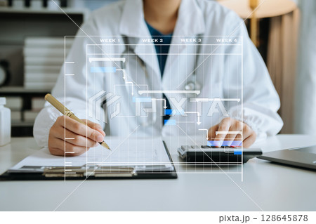 Project manager working and update tasks with Gantt chart scheduling diagram at hospital .success smart medical doctor working with smart medical doctor  concept. 128645878