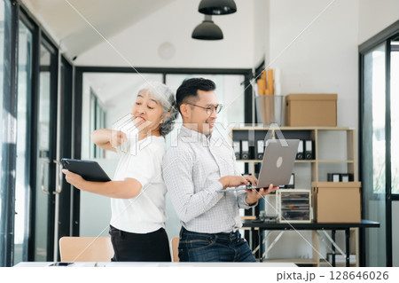Portrait of success business people working together in office. Portrait of success business people working together in office. 128646026