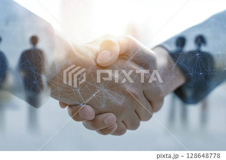 握手をするビジネスパーソン（デジタル社会イメージ） 128648778