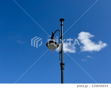a street lamp on a blue sky background. High quality photo 128648854