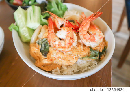 creamy omelet or omelet or omelette or fried egg with shrimp and squid or seafood omelette and rice 128649244