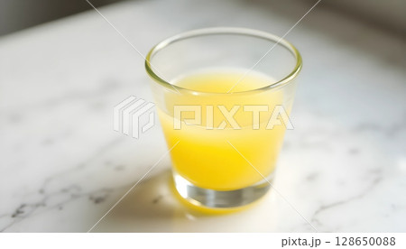 Tangy Lime Juice with Slice in Elegant Glass 128650088
