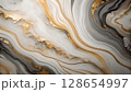 Abstract swirling marble texture with veins of gold and gray 128654997