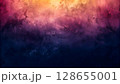 Textured abstract background with gradient of warm orange, pink, purple, and dark blue hues 128655001