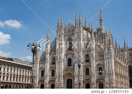 Milan Cathedral (Duomo di Milano). Gothic architecture against the blue sky, Italy. 128655143
