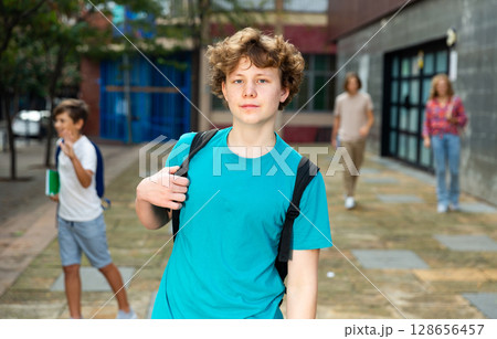 Young boy coming home after school classes 128656457