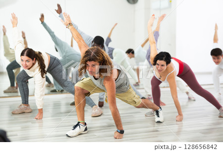 Man doing stretching workout before dance training 128656842