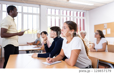 Positive young female student studying on training session 128657179