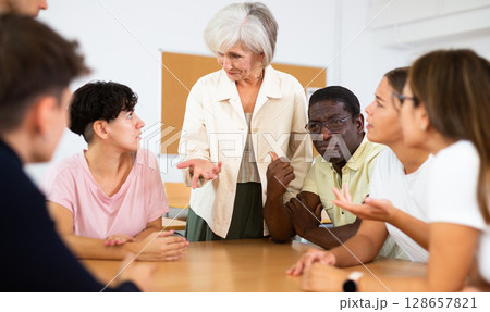Group of people attending language course 128657821