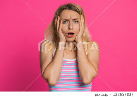 Sad young woman loses becoming surprised by lottery results bad fortune loss unlucky fortune news 128657837