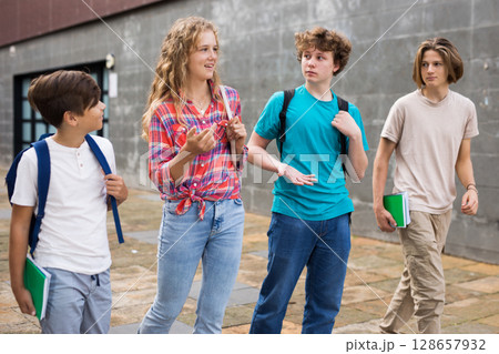 School friends walk after class 128657932