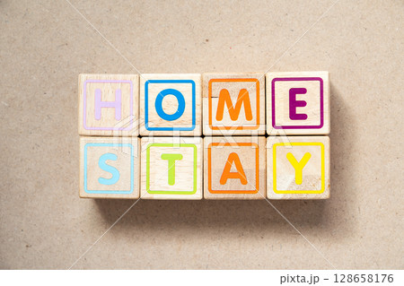 Alphabet letter block in word home stay on wood background Alphabet letter block in word home stay on wood background 128658176