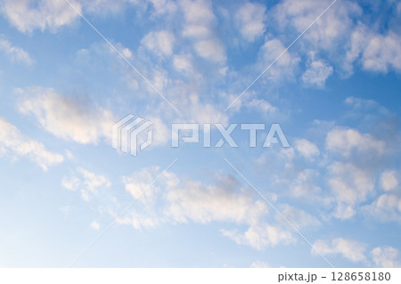 Clear blue sky with white cloud background Clear blue sky with white cloud background 128658180