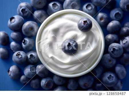Bowl of organic natural yogurt and fresh raw ripe blueberries.Macro.AI Generative 128658487