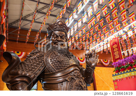 Guan Yu sculpture statue against flags in Longhua temple, Shanghai 128661619