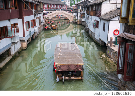 tourist motor boat sailing to city god temple bridge, Zhujiajiao 128661636