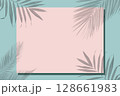 On a green background, a pink frame for text covered with a shadow from tropical leaves. 128661983