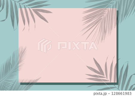 On a green background, a pink frame for text covered with a shadow from tropical leaves. On a green background, a pink frame for text covered with a shadow from tropical leaves. 128661983