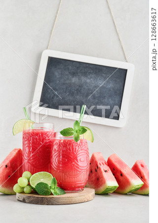 Fresh watermelon juice with framed chalk board. Fresh watermelon juice with framed chalk board. 128663617