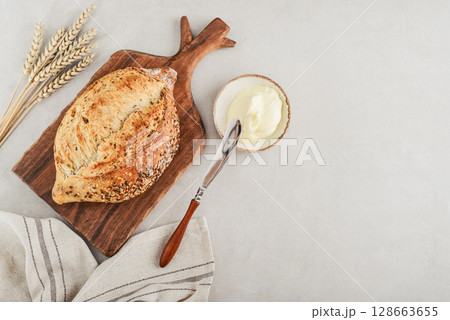 Tasty multigrain french bread with butter 128663655