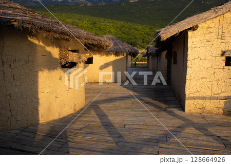 mud houses bungalow on the shore of the lake 128664926
