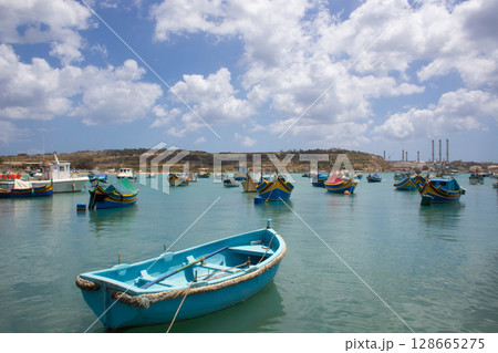 beautiful ships and boats are moored near the shore 128665275