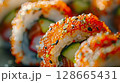Close-Up: Spicy Sashimi Rolls with Tuna or Salmon, Avocado, Cucumber, Spicy Mayo, and Tobiko 128665431