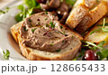 Classic Pate de Foie Gras: Smooth foie gras with cognac or Armagnac, served on toasted brioche or baguette with sweet fruit compote. 128665433