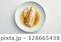 Ginger-Soy Turbot Meuniere: Vibrant Presentation on Clean White Background 128665438