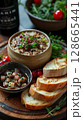 Classic Pate de Foie Gras: Smooth foie gras with cognac or Armagnac, served on toasted brioche or baguette with sweet fruit compote. 128665441