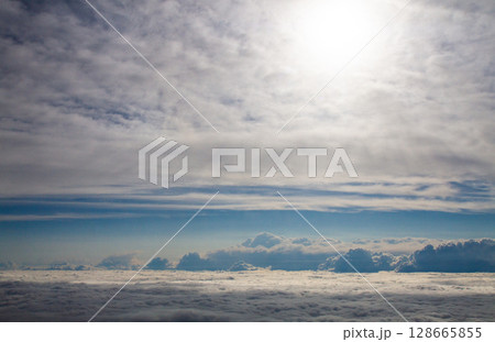 beautiful thick clouds in the sky from the height of the plane 128665855
