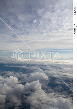beautiful thick clouds in the sky from the height of the plane 128665856