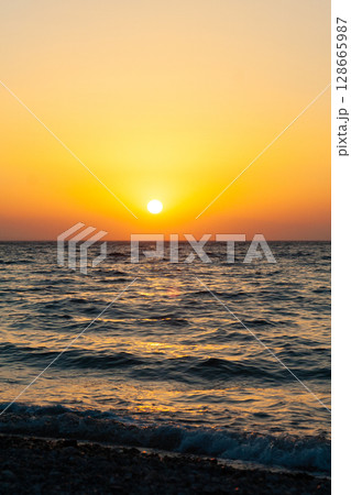 beautiful dramatic landscape of sunset on the sea beach beautiful dramatic landscape of sunset on the sea beach 128665987