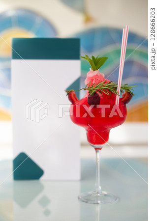close up of a beautiful fruity alcoholic cocktail 128666203