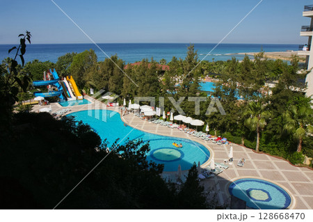 a beautiful large swimming pool near the house 128668470