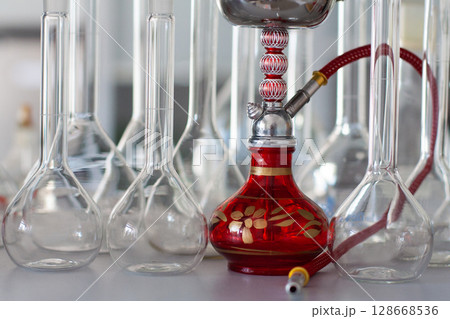 composition of red hookah and chemical glass flasks 128668536